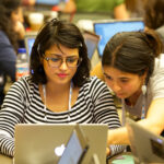 Women coding at the Code-a-thon