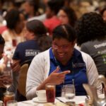 Attendees laughing during Friday Luncheon