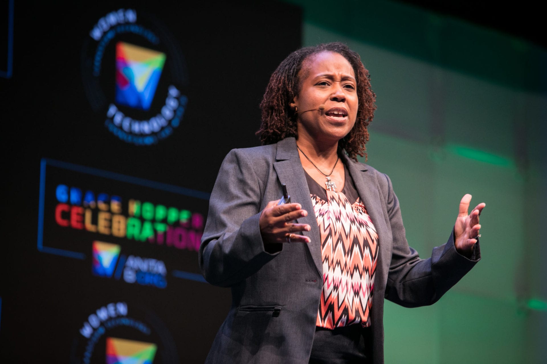 Dr. Ayanna Howard stands and gives her speech on the main stage at the GHC 17 Friday Keynote