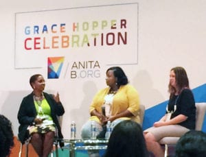 Moderator Valerie Taylor, left, talks to Tarsha McCormick, center, and Pam Siebert,, right, during a panel on underrepresented women in tech at GHC 17.