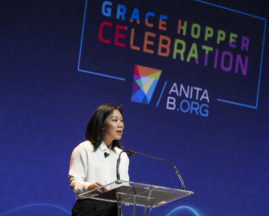 Priscilla Chan speaks behind the podium during her GHC 18 Featured Session