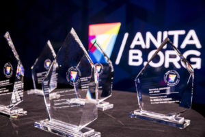 The crystal Abie Awards stand on a table in front of the AnitaB.org logo