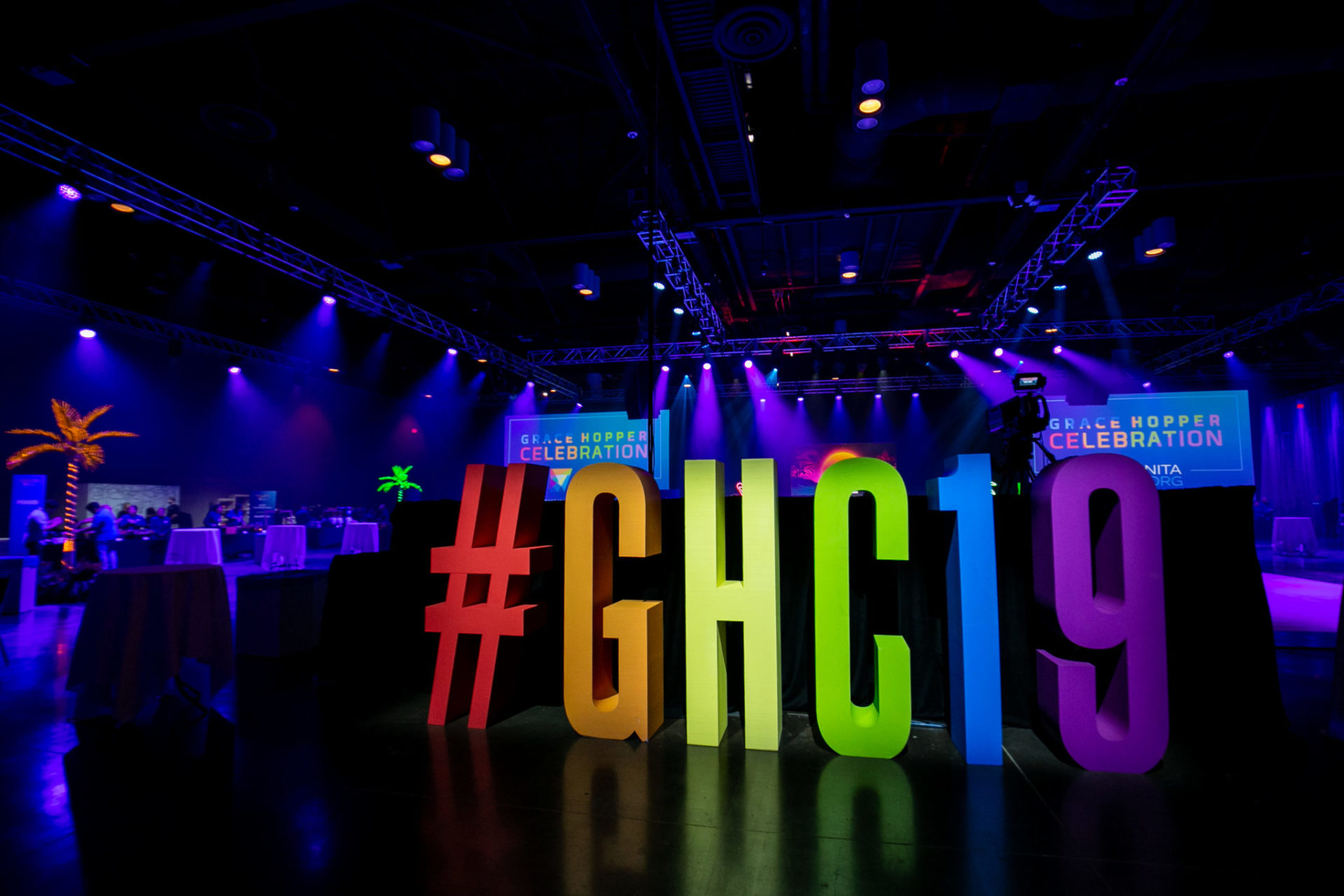 A large, colorful #GHC19 sign greets people at the entrance to the GHC 19 Evening Celebration