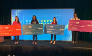 The four winners of the 2019 PitcHER competition hold their giant checks