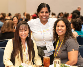 Three female attendees at the GHC 19 Women of Color in Tech Reception